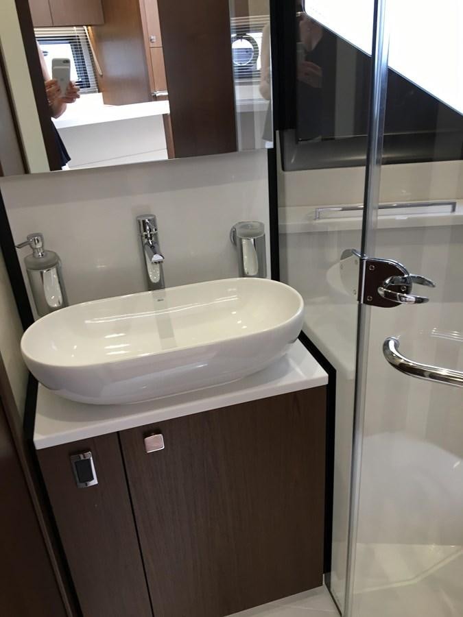 a bathroom sink with a mirror aboard LYDIA SWAG Yacht for Sale