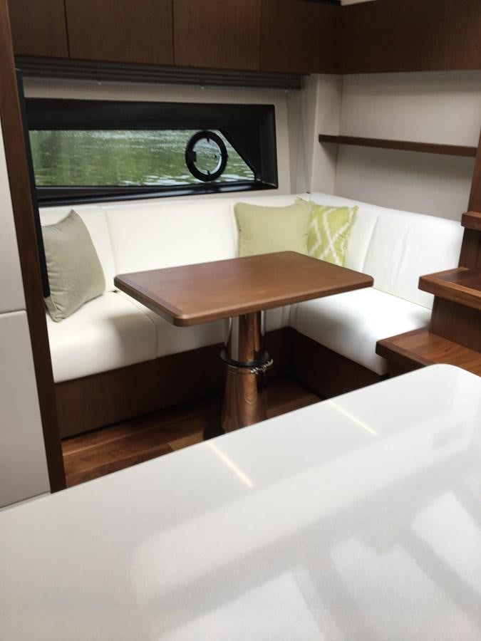 a table with a glass on it aboard LYDIA SWAG Yacht for Sale