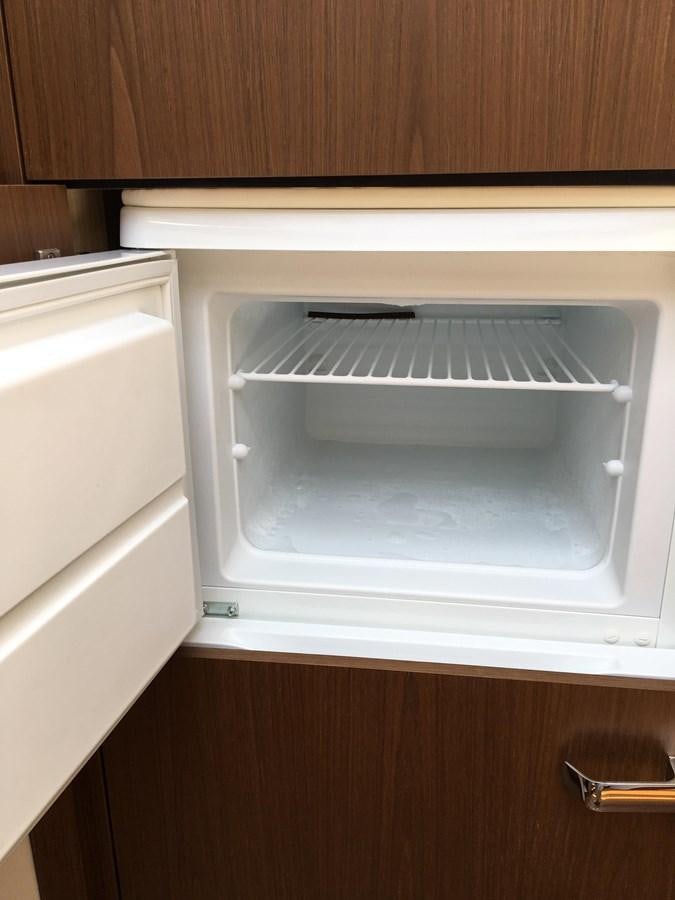 a white refrigerator in a kitchen aboard LYDIA SWAG Yacht for Sale