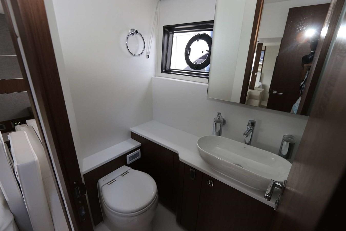 a bathroom with a sink and a toilet aboard LYDIA SWAG Yacht for Sale