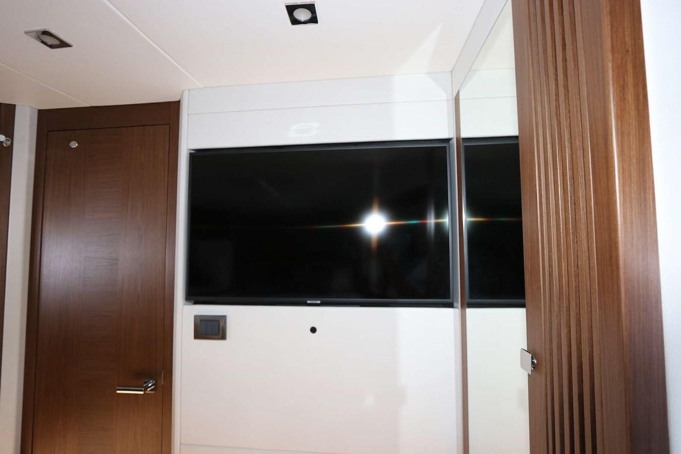 a room with a door and a mirror aboard LYDIA SWAG Yacht for Sale
