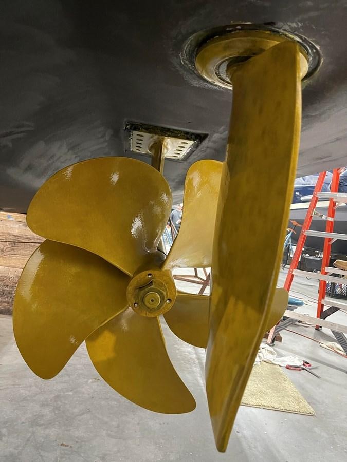 a wooden skateboard on a wooden stand aboard LYDIA SWAG Yacht for Sale