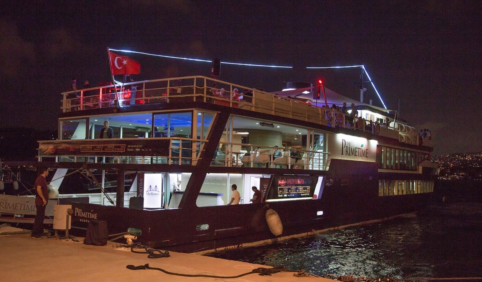 a boat with lights on the deck aboard 2011 CUSTOM PASSENGER CRUISE SHIP Yacht for Sale