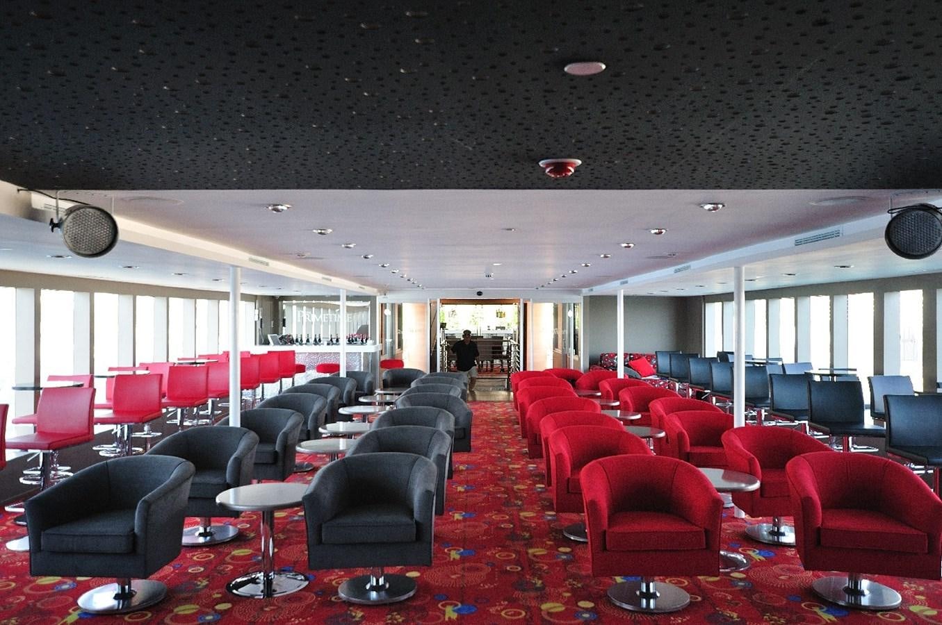 a room with chairs and tables aboard 2011 CUSTOM PASSENGER CRUISE SHIP Yacht for Sale