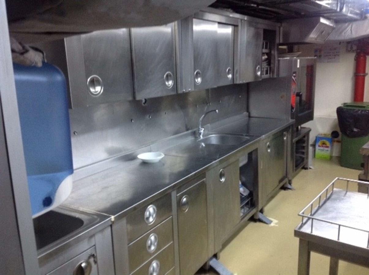 a kitchen with a large counter aboard 2011 CUSTOM PASSENGER CRUISE SHIP Yacht for Sale