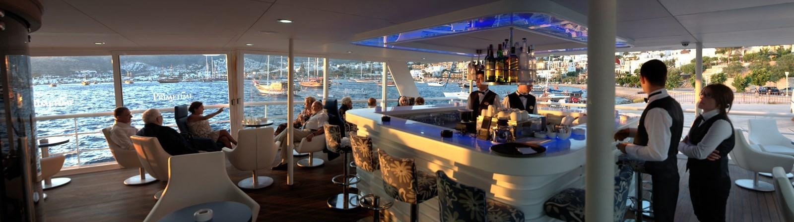 a group of people sitting at a table in a restaurant aboard 2011 CUSTOM PASSENGER CRUISE SHIP Yacht for Sale