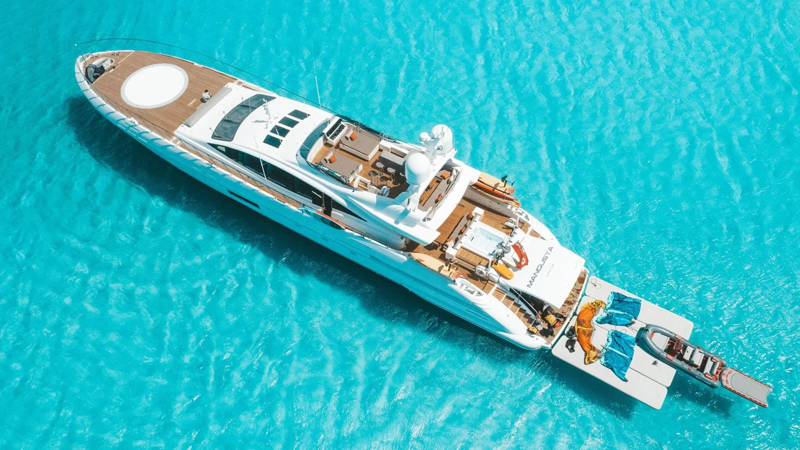 a spaceship flying over a planet aboard MANGUSTA Yacht for Sale