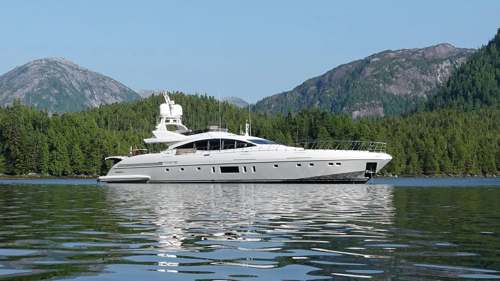 a white boat on water aboard MANGUSTA Yacht for Sale