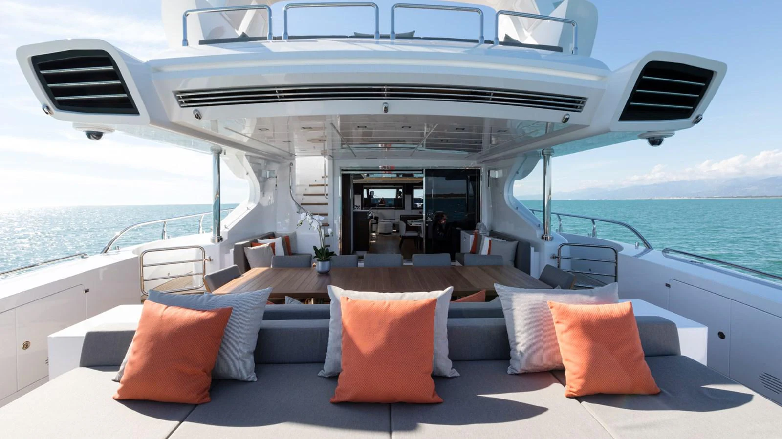 a boat with pillows on a deck aboard MANGUSTA Yacht for Sale