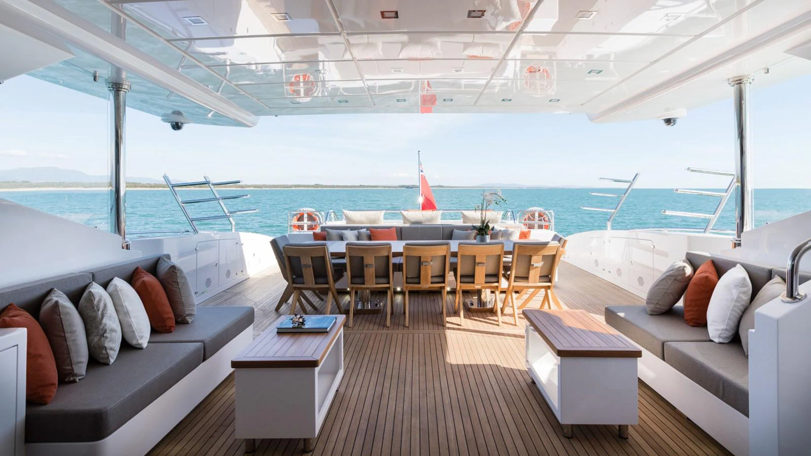 a deck with a couch and a pool aboard MANGUSTA Yacht for Sale