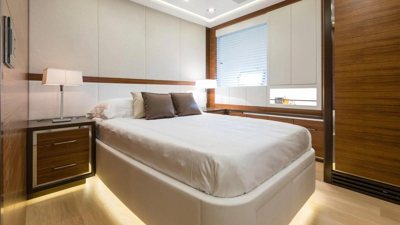 a bed in a room aboard MANGUSTA Yacht for Sale