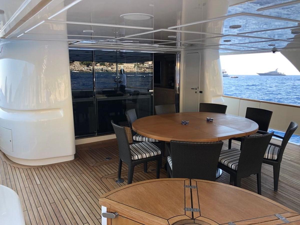 a room with a table and chairs aboard NAVETTA 33 CRESCENDO Yacht for Sale