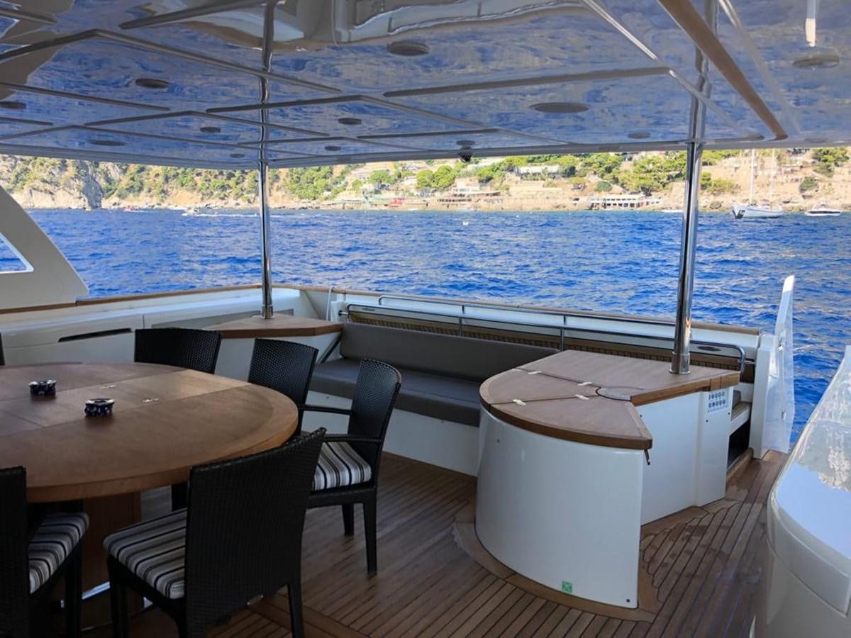 a room with a table and chairs aboard NAVETTA 33 CRESCENDO Yacht for Sale