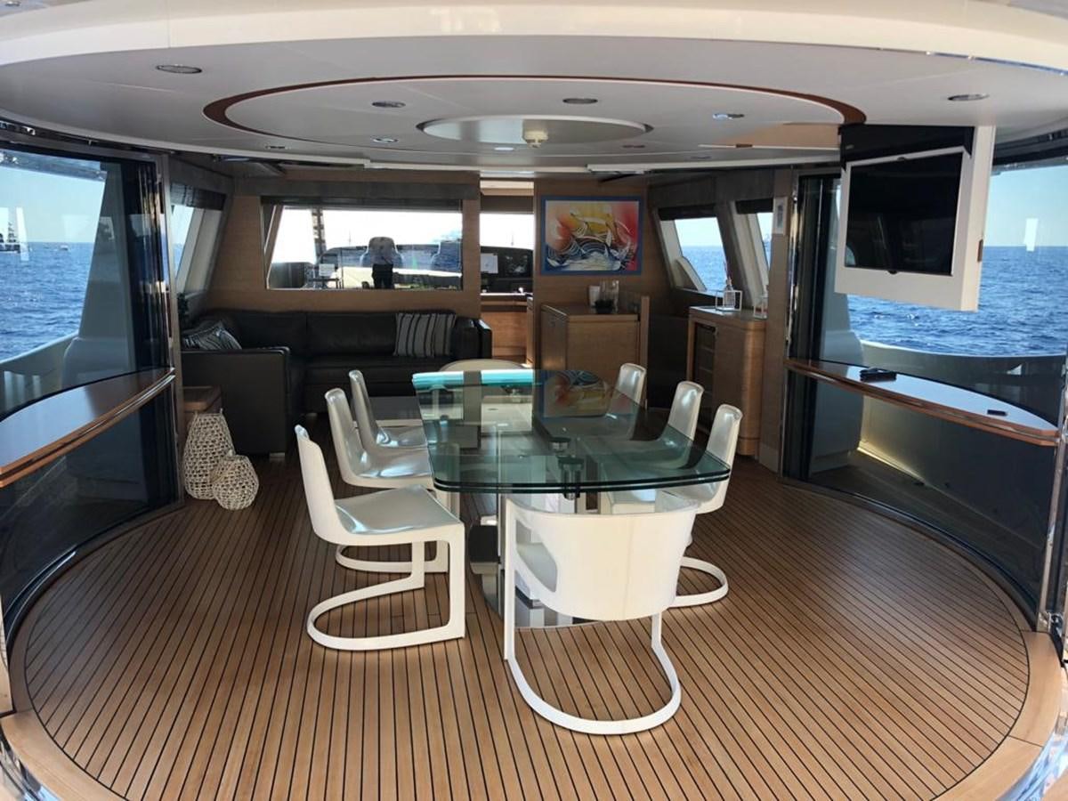 a room with a table and chairs aboard NAVETTA 33 CRESCENDO Yacht for Sale