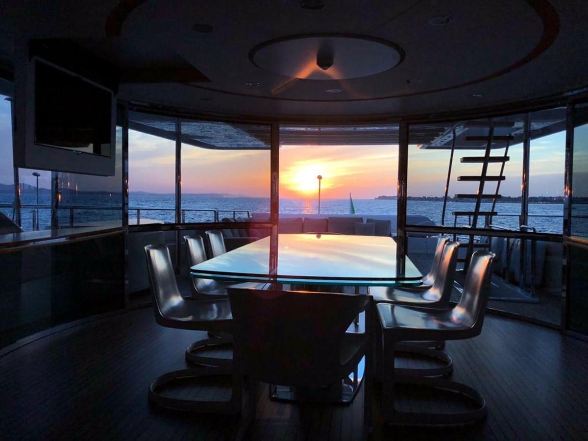 a pool table in a room with a large window aboard NAVETTA 33 CRESCENDO Yacht for Sale
