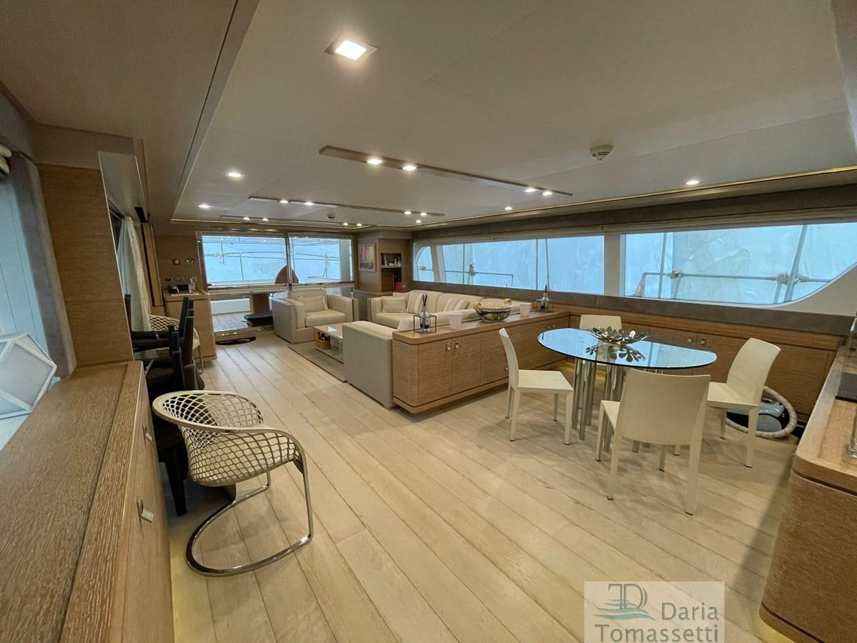 a living room with a table and chairs aboard NAVETTA 33 CRESCENDO Yacht for Sale