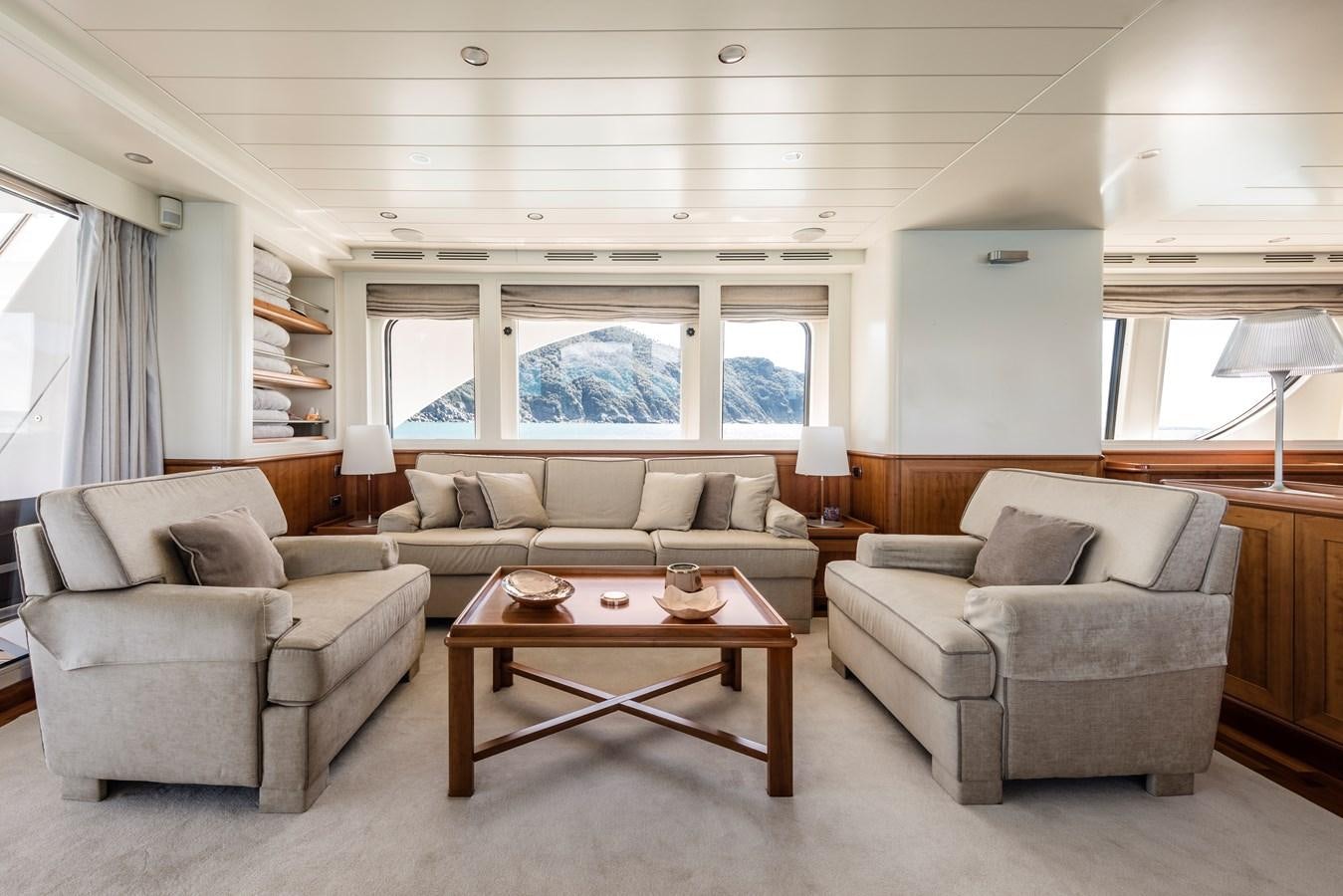 a living room with a couch and a coffee table aboard ARCHIPELAGO Yacht for Sale