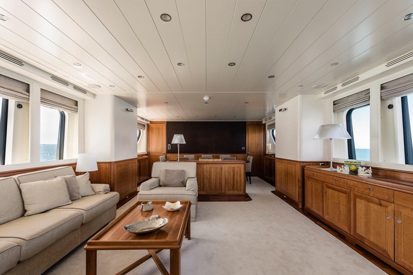 a living room with a couch and a coffee table aboard ARCHIPELAGO Yacht for Sale