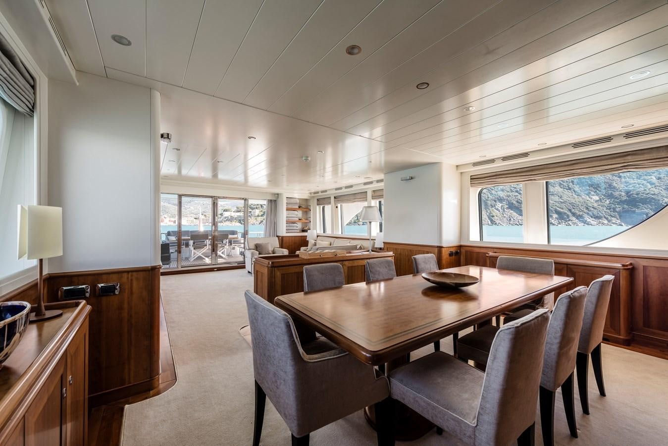 a large dining table in a room aboard ARCHIPELAGO Yacht for Sale
