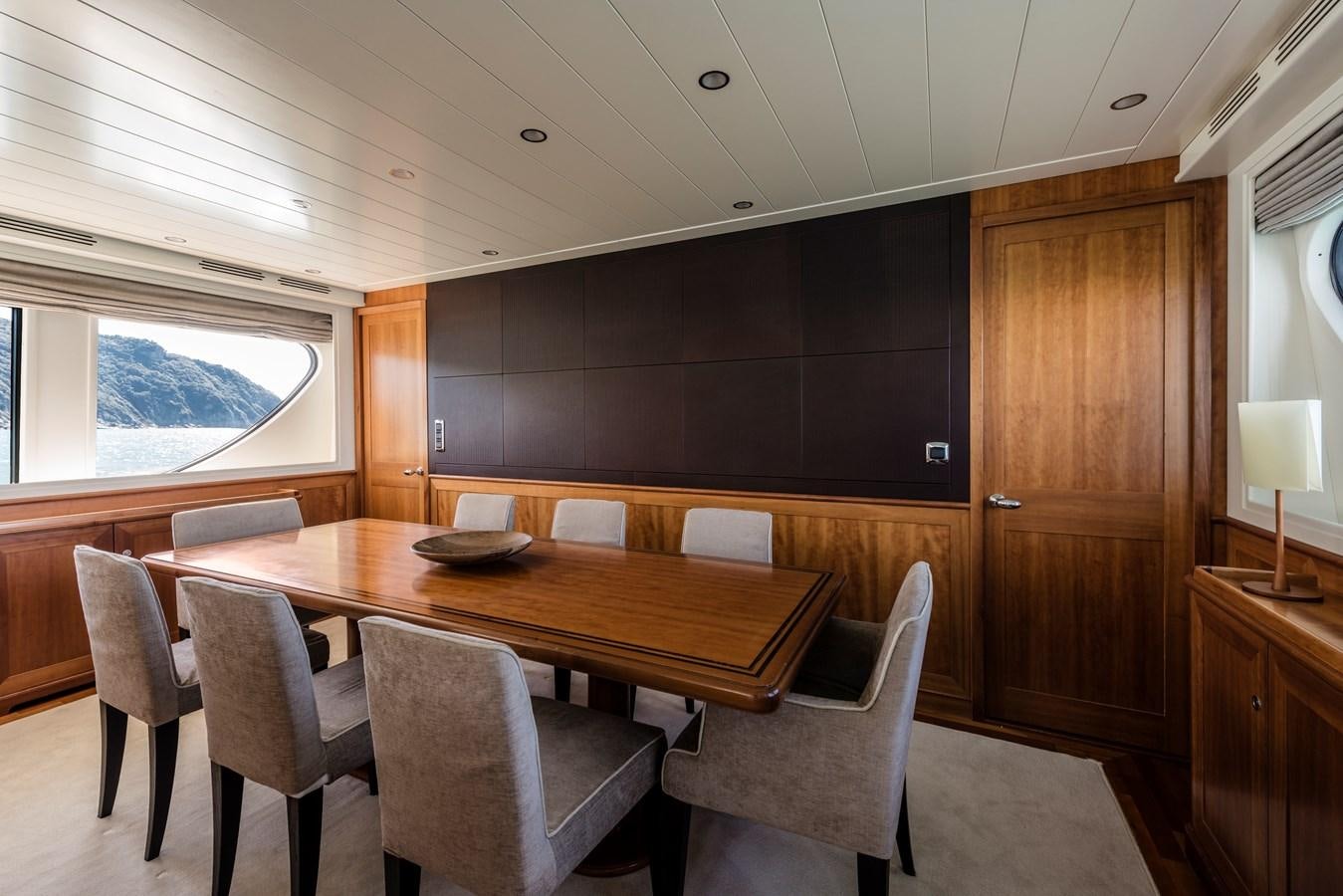 a room with a table chairs and a blackboard aboard ARCHIPELAGO Yacht for Sale