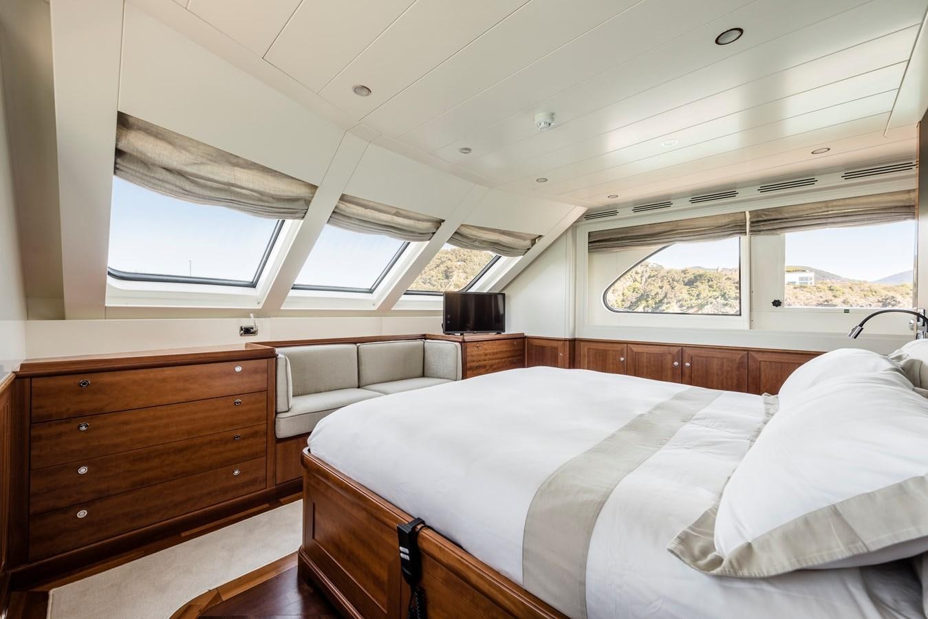 a room with a bed and a window aboard ARCHIPELAGO Yacht for Sale