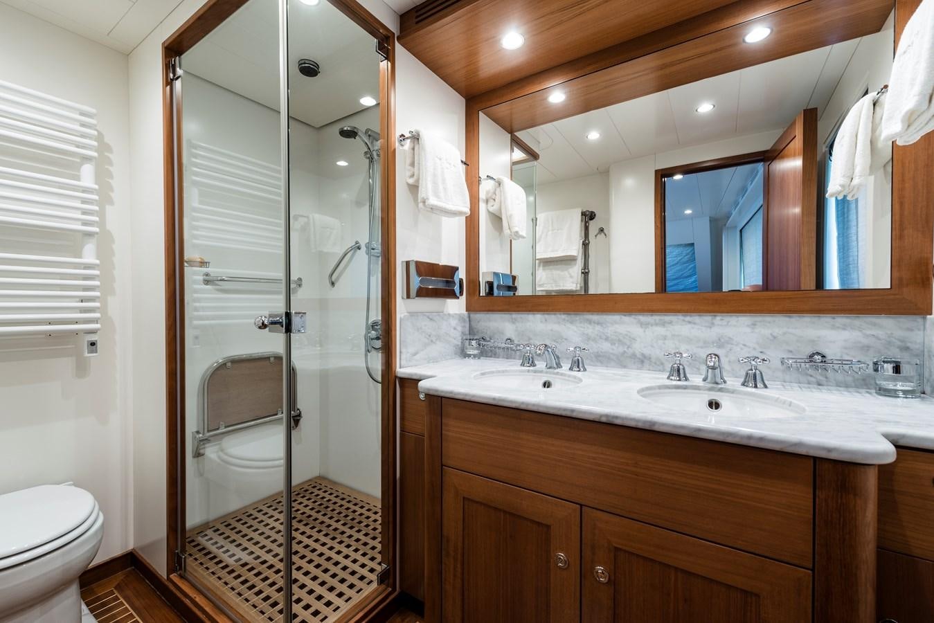 a bathroom with a large mirror aboard ARCHIPELAGO Yacht for Sale