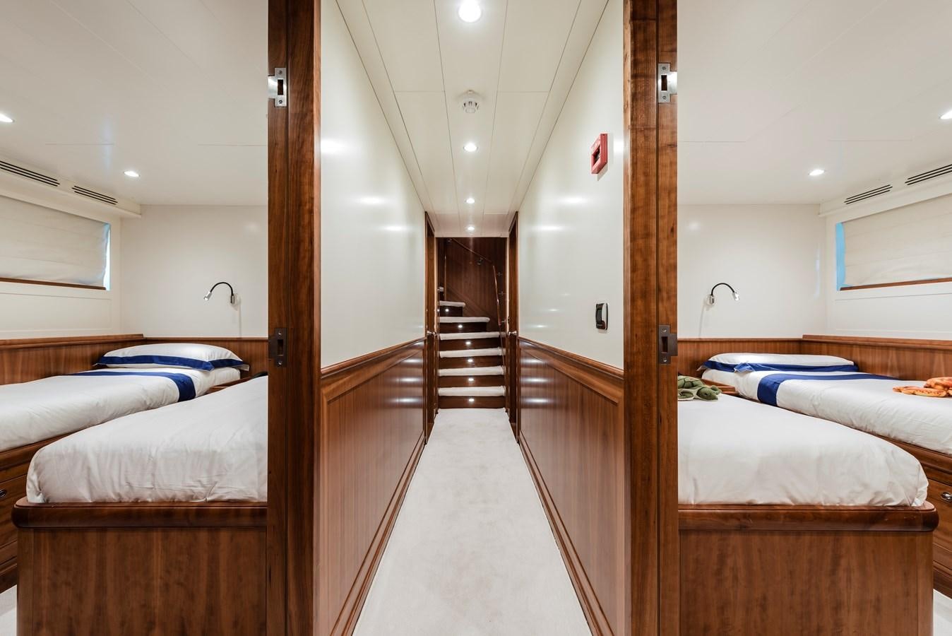 a room with a couple of beds aboard ARCHIPELAGO Yacht for Sale