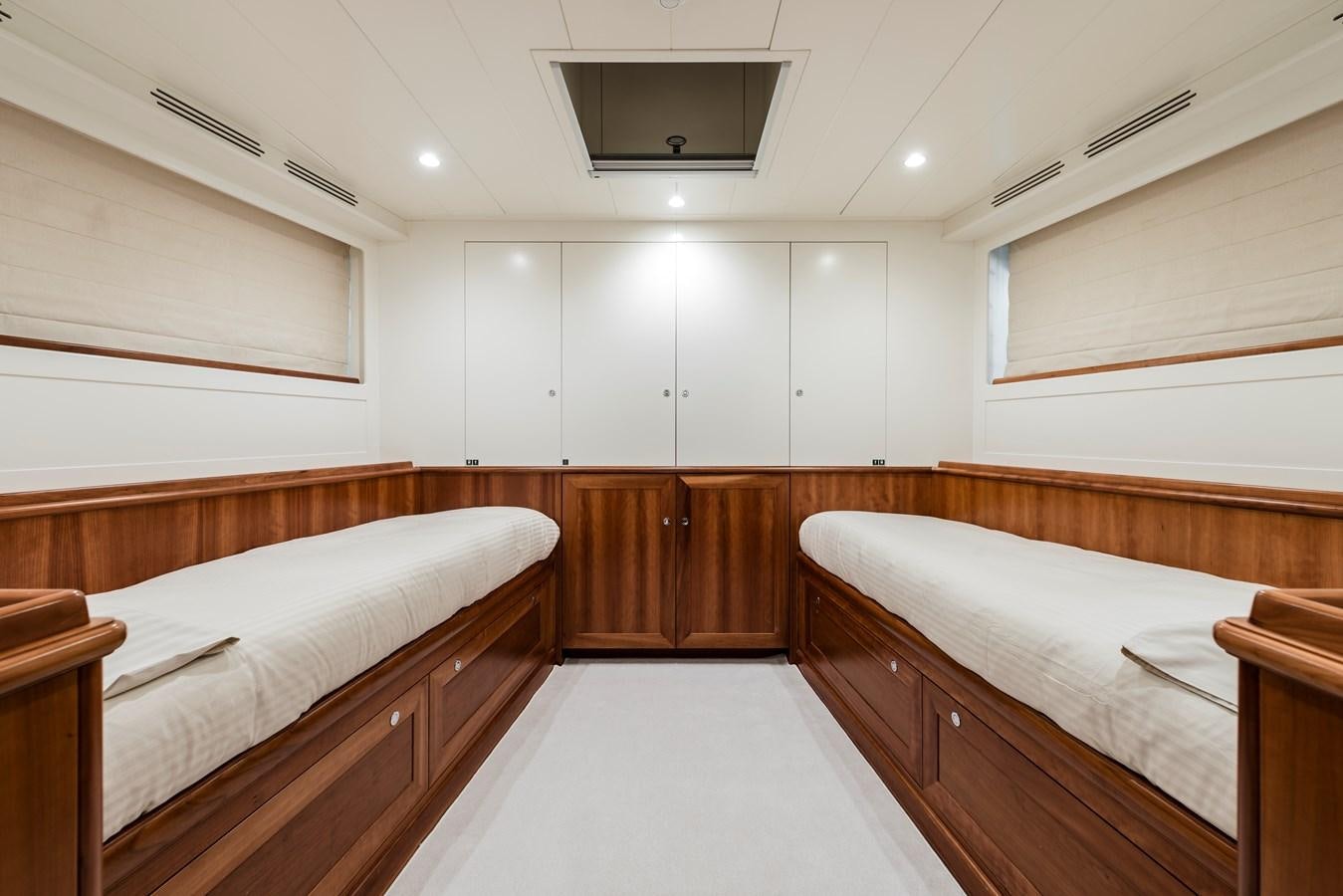 a room with wooden furniture aboard ARCHIPELAGO Yacht for Sale