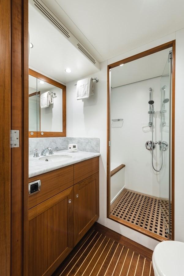 a bathroom with a sink and a mirror aboard ARCHIPELAGO Yacht for Sale
