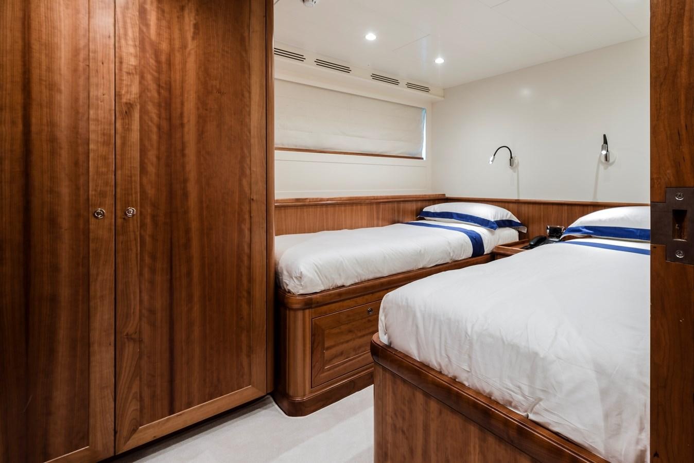 a room with a couple of beds aboard ARCHIPELAGO Yacht for Sale