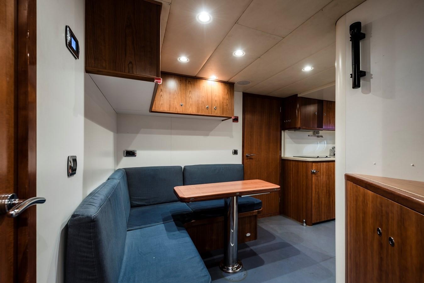 a room with a couch and a table aboard ARCHIPELAGO Yacht for Sale
