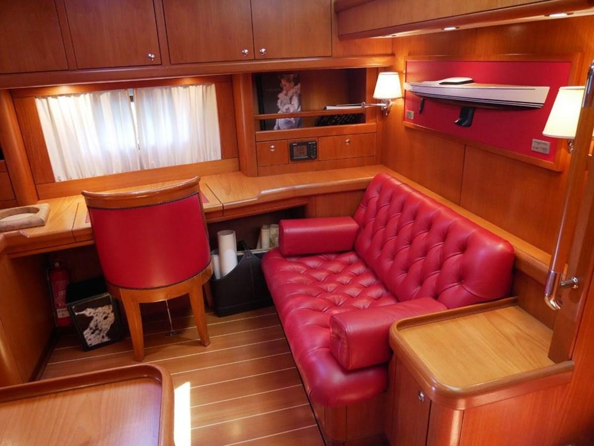 a room with a couch and a chair aboard STARFALL Yacht for Sale