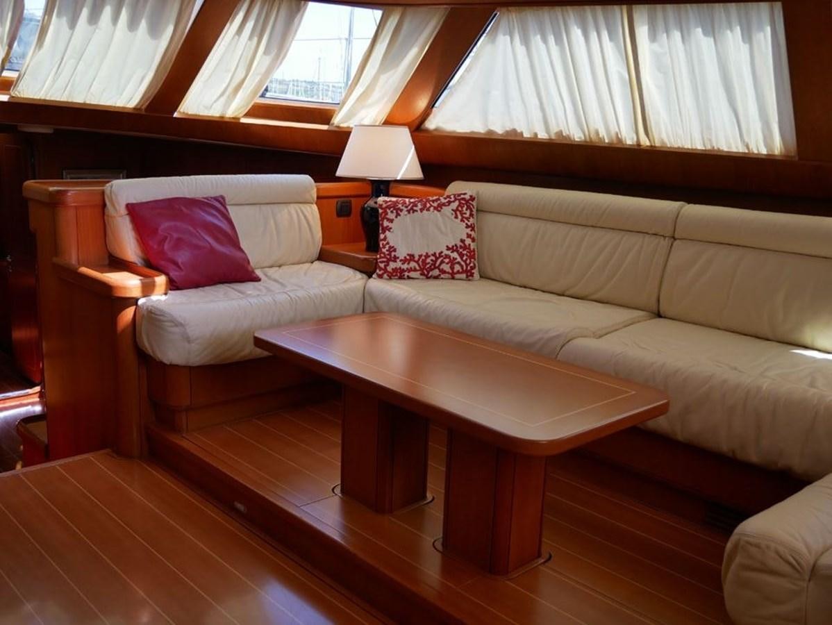a couch with a coffee table aboard STARFALL Yacht for Sale
