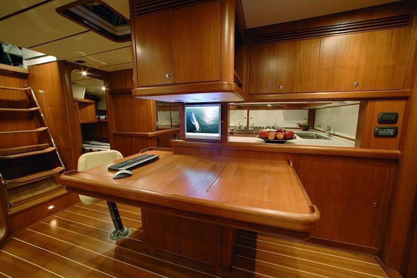 a kitchen with wooden cabinets aboard STARFALL Yacht for Sale