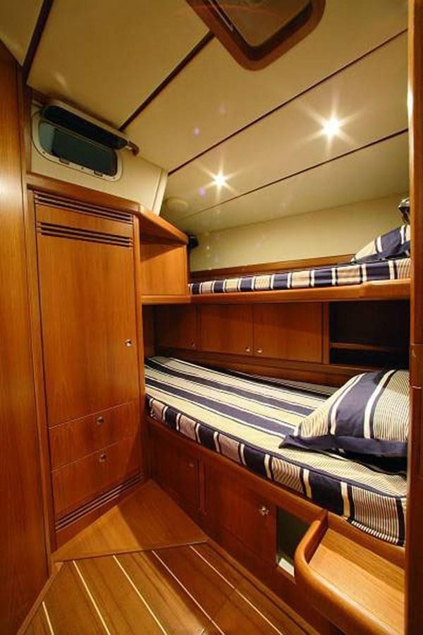 a bedroom with a bunk bed aboard STARFALL Yacht for Sale
