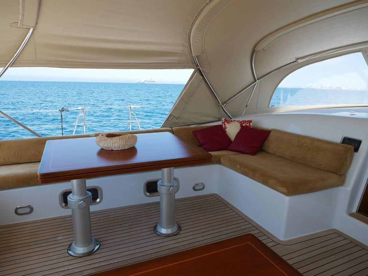 a room with a bed and a window aboard STARFALL Yacht for Sale