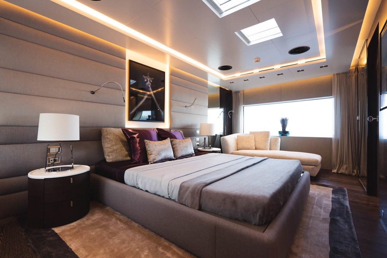 a large bedroom with a large bed aboard JESMA II Yacht for Charter