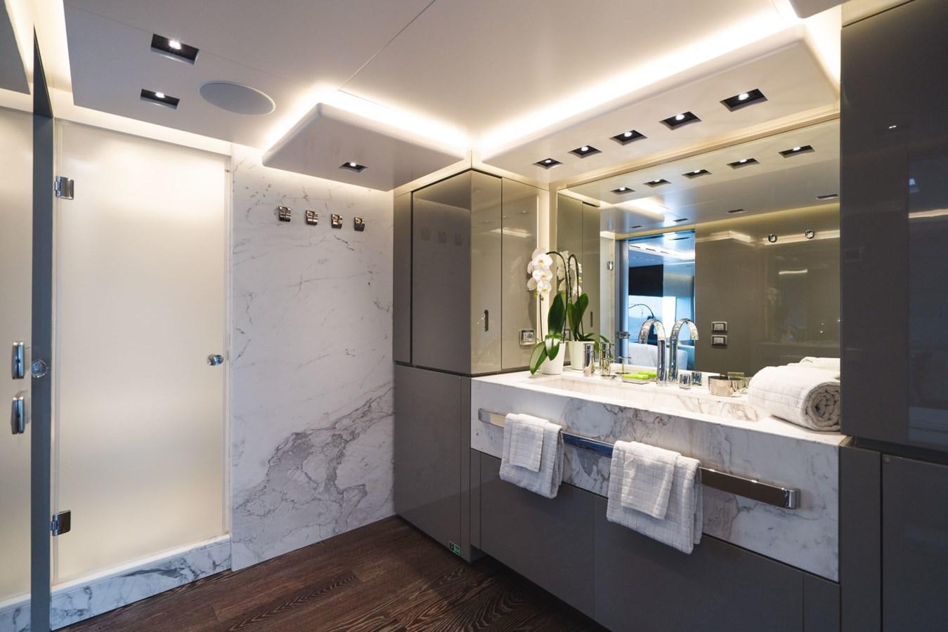 a bathroom with a large mirror aboard JESMA II Yacht for Charter
