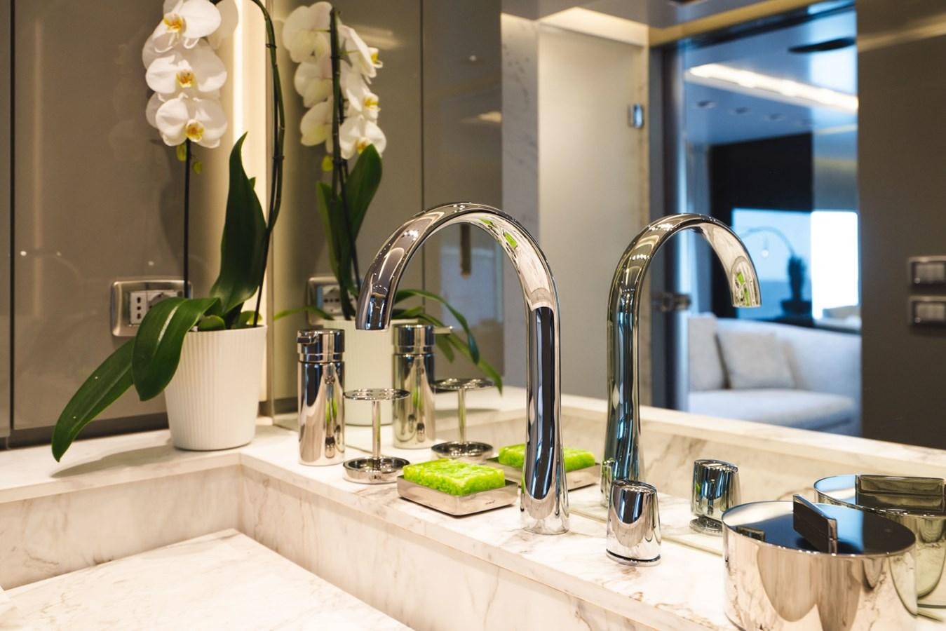 a bathroom with a large mirror aboard JESMA II Yacht for Charter