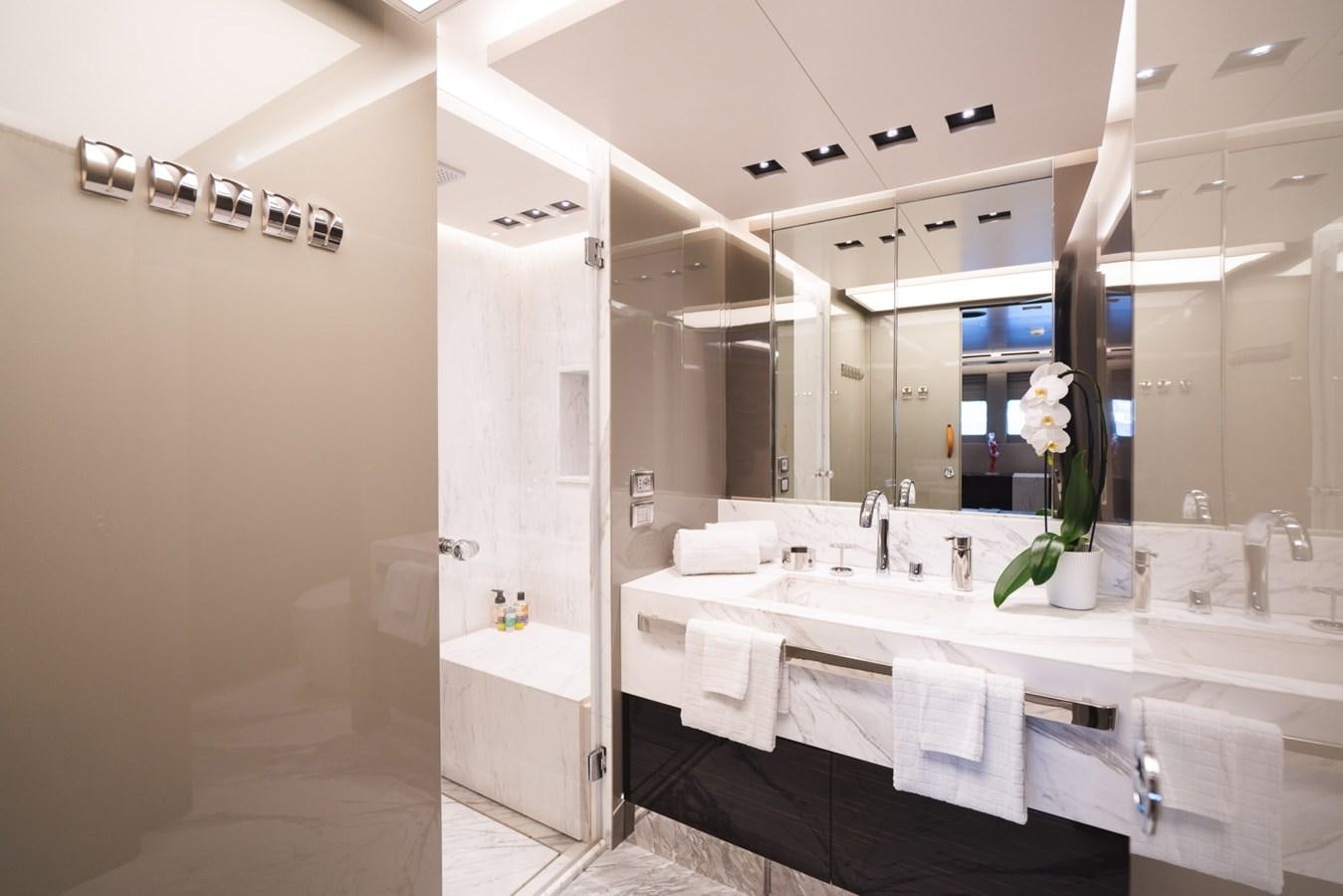 a bathroom with a large mirror aboard JESMA II Yacht for Charter