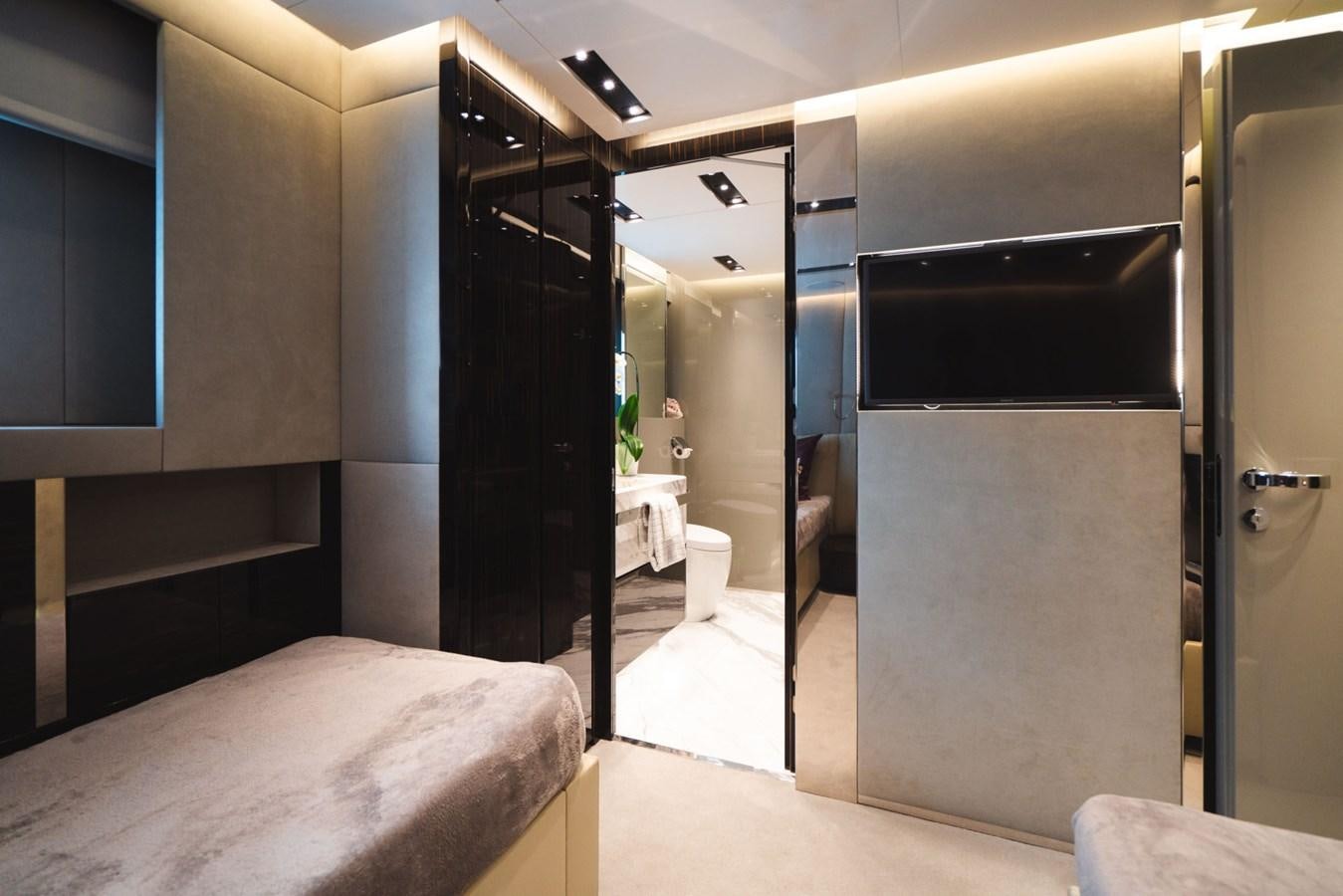 a room with a bed and a large closet aboard JESMA II Yacht for Charter