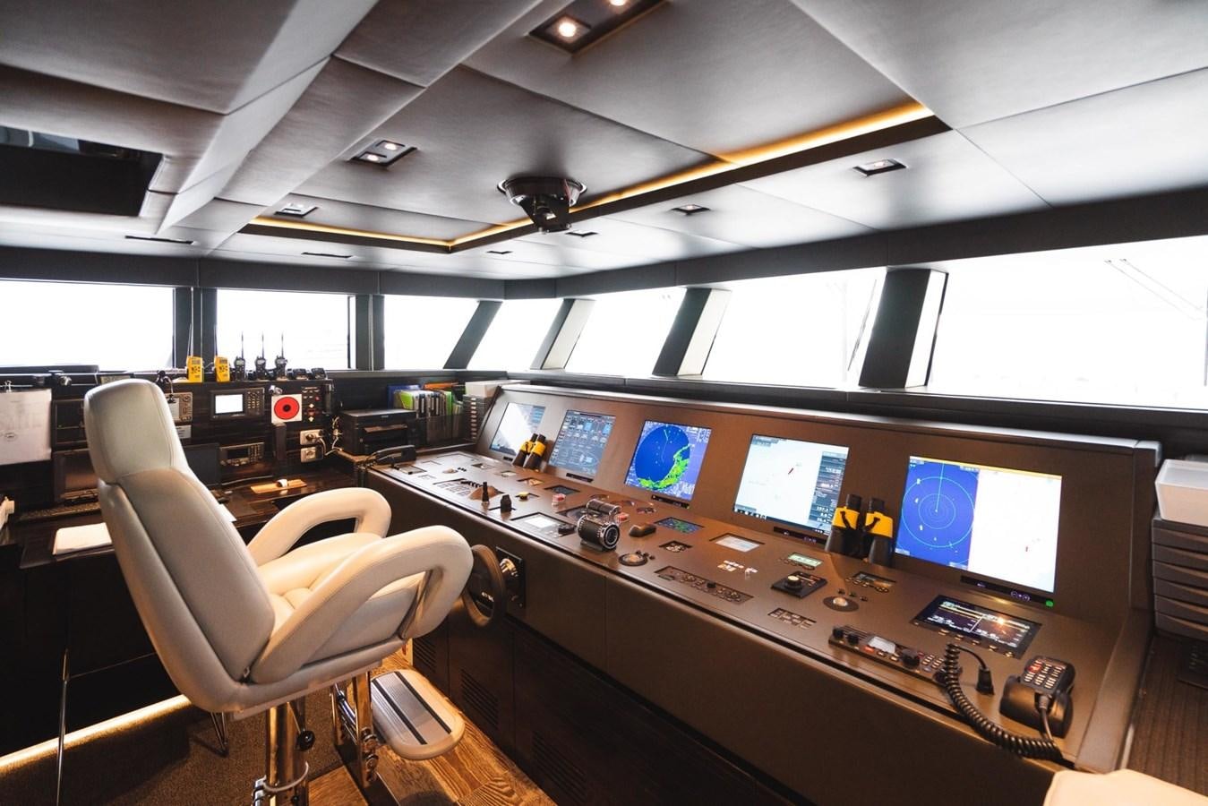 a room with computers and monitors aboard JESMA II Yacht for Charter