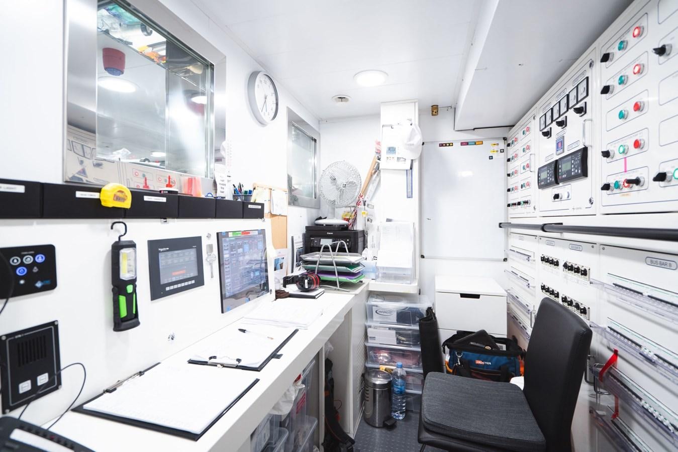 a room with computers and monitors aboard JESMA II Yacht for Sale