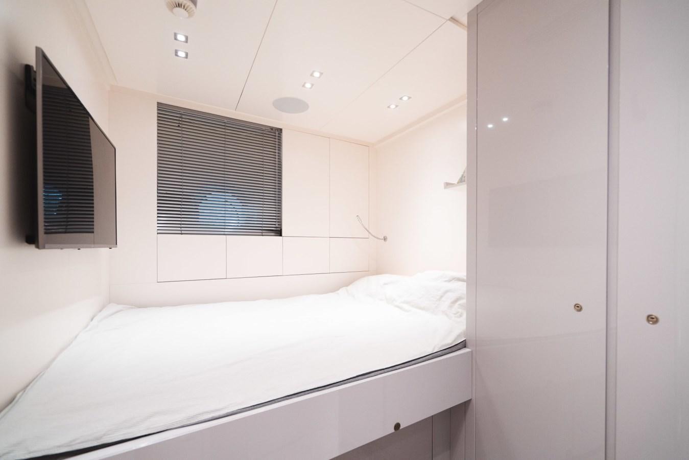 a room with a bed and a window aboard JESMA II Yacht for Charter