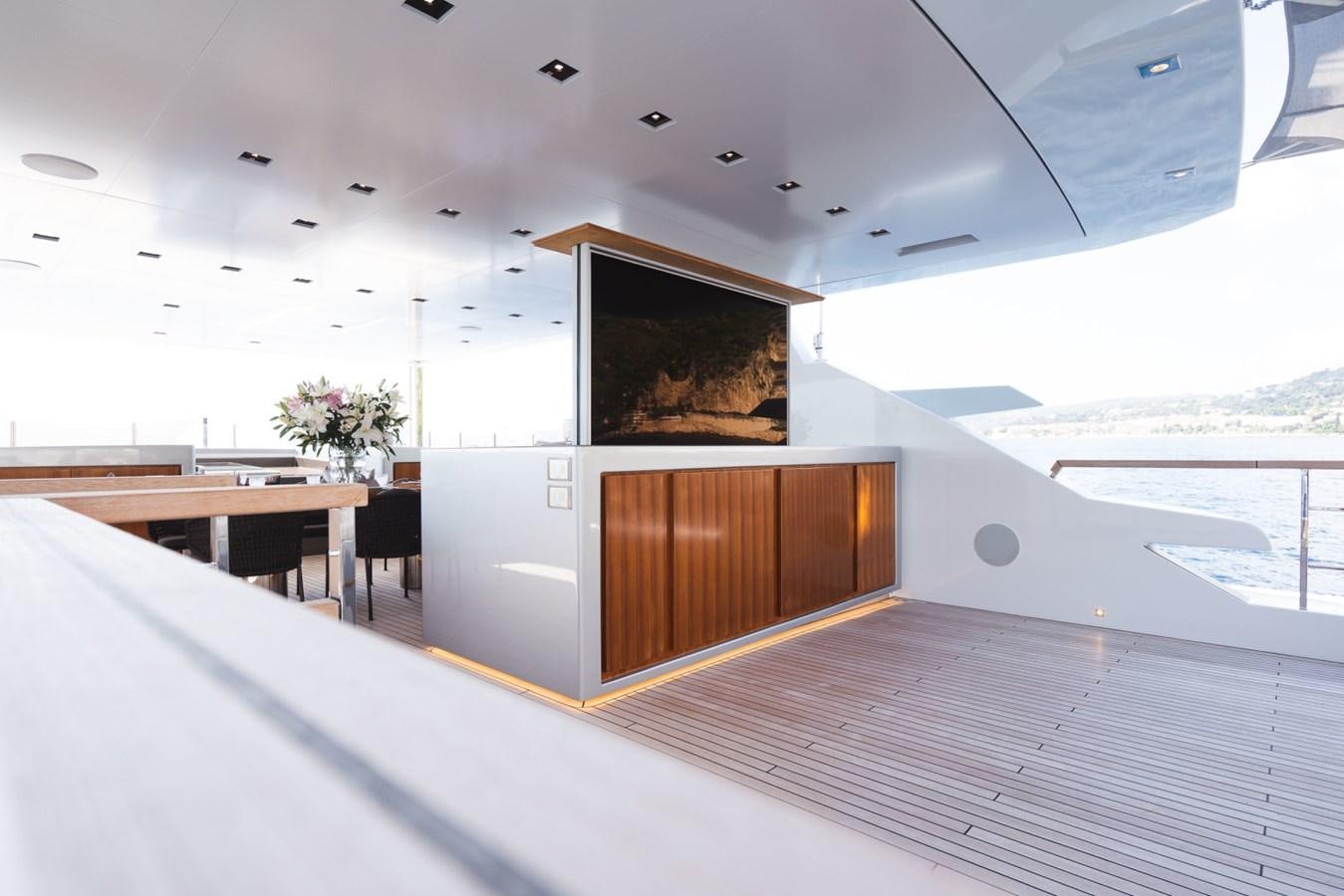 a room with a large window and a wood door aboard JESMA II Yacht for Charter