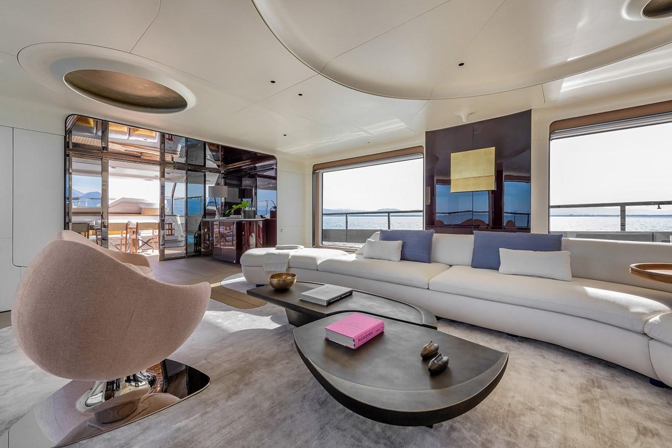 a living room with a couch and a coffee table aboard AZIMUT GRANDE TRIDECK 38M Yacht for Sale