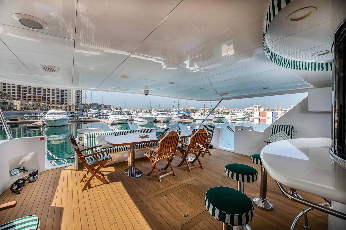 a room with tables and chairs aboard WILDE WHALE Yacht for Sale