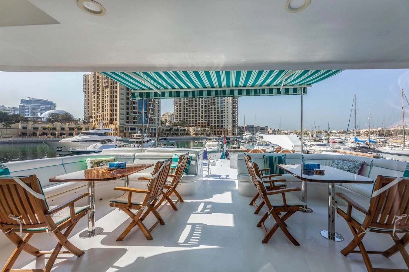 a room with tables and chairs aboard WILDE WHALE Yacht for Sale