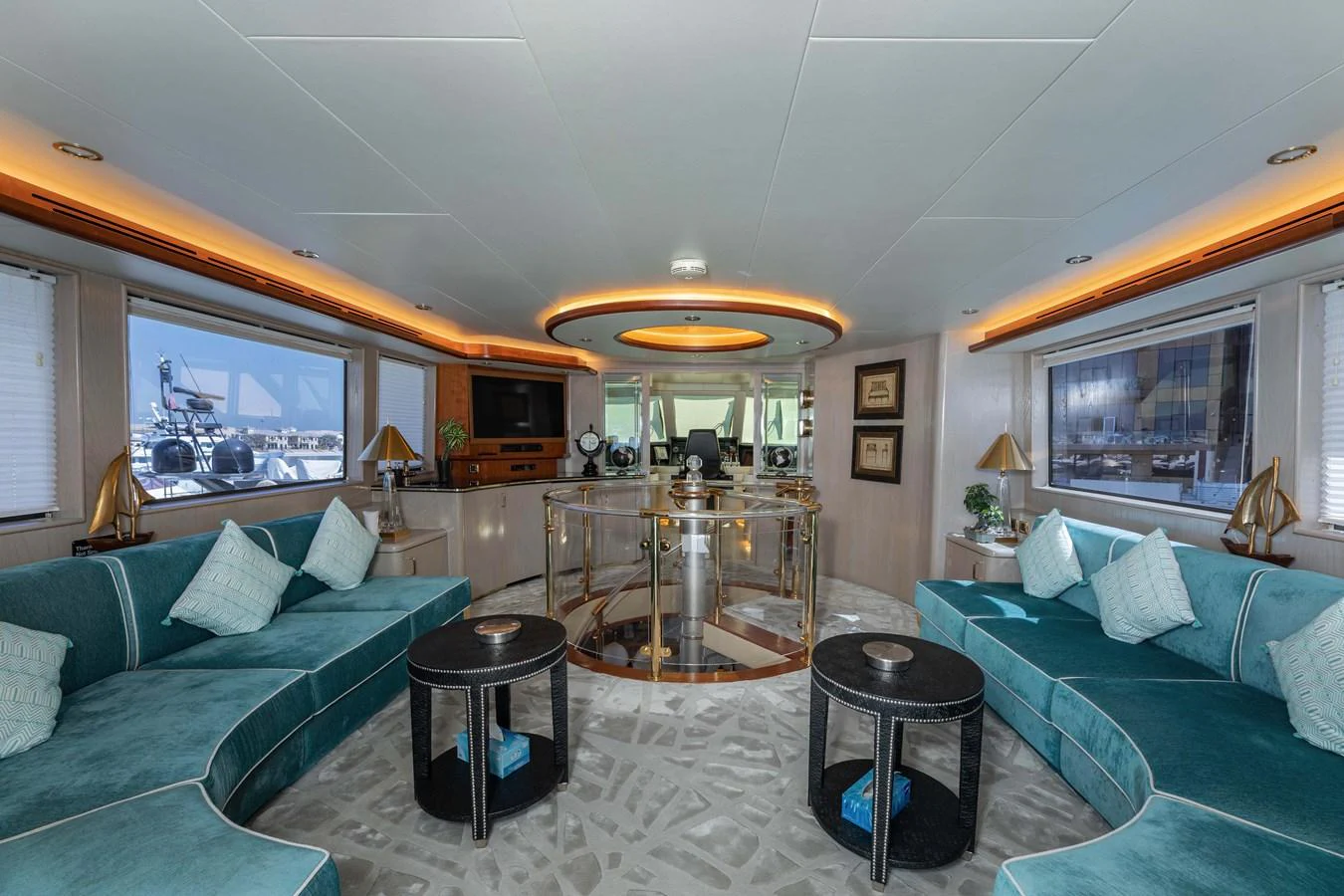 a living room with a large glass table and a large window aboard WILDE WHALE Yacht for Sale