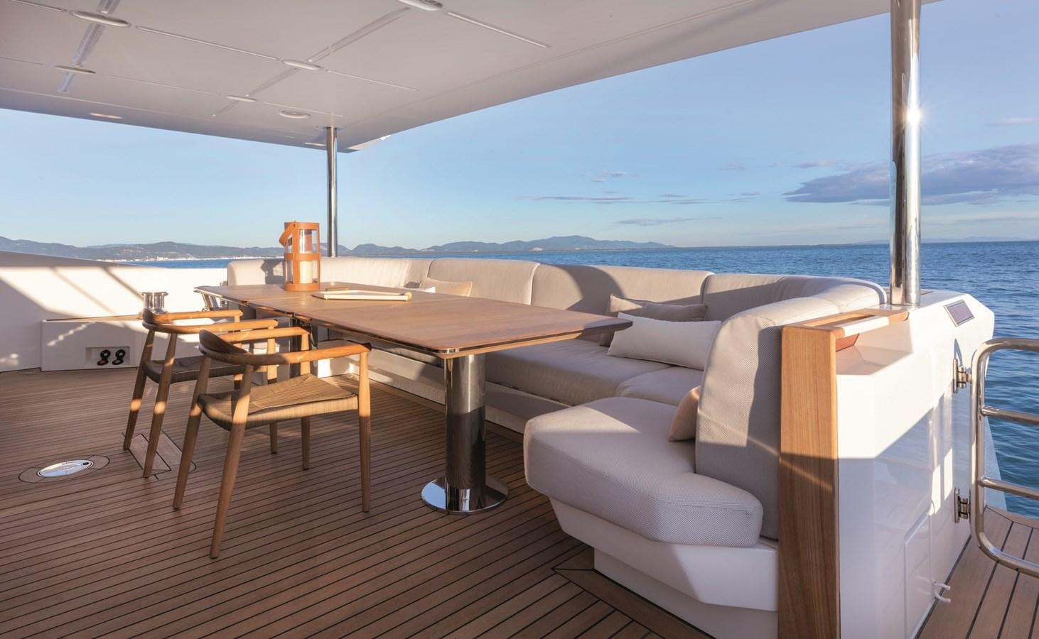 a room with a table and chairs aboard LA MAMA Yacht for Sale